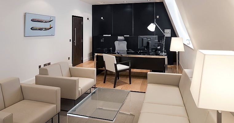 Settees and desk in home office