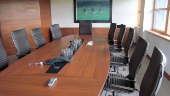 Mahogany board table in paneled room