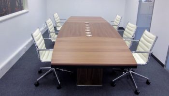 Light oak table in white office
