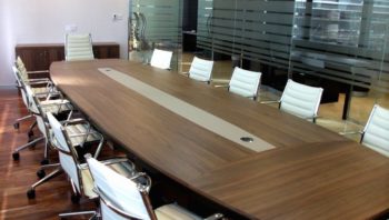 Modern board table with white leather chairs