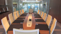 Large boardroom table in glass office