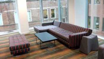 settee and stools in shared space
