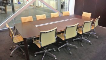 Meeting table in glass walled office