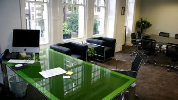 Glass top desk and table in home office