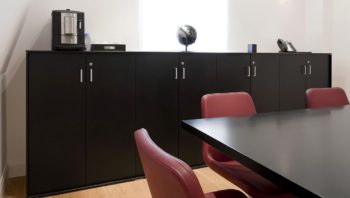 Storage cabinet behind table