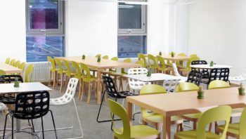 Tables and chairs in student dining area