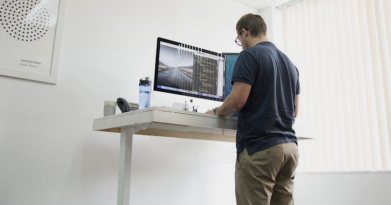 Designer at standing desk