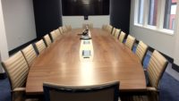 Walnut boardroom table and chairs