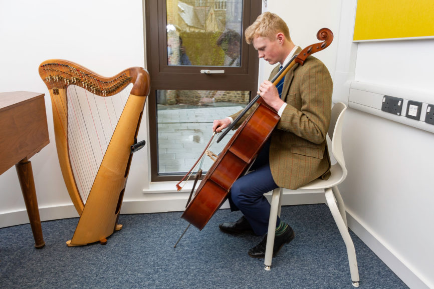 Student using music school furniture